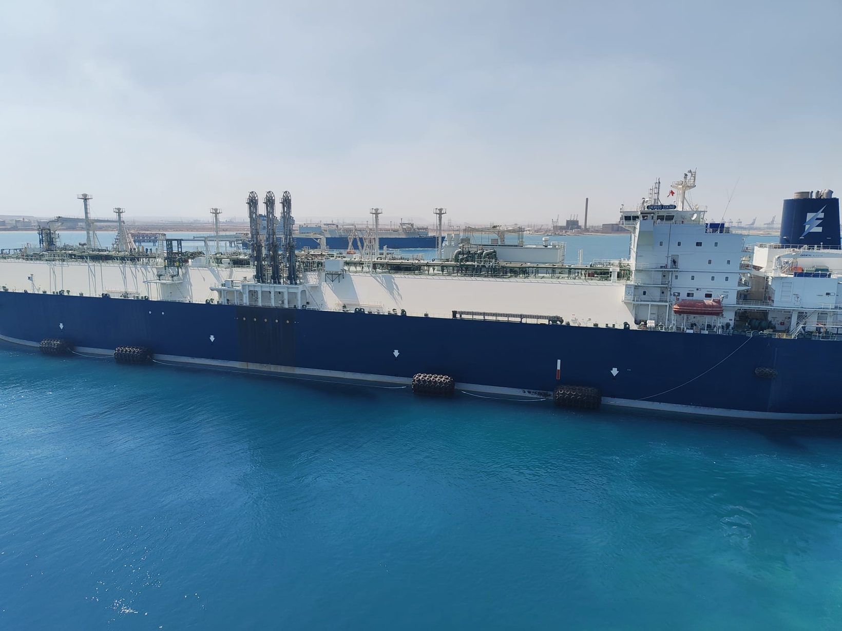 Broadside view of the FSRU moored alongside with pneumatic fenders during the STS operation at Ain Sukhna
