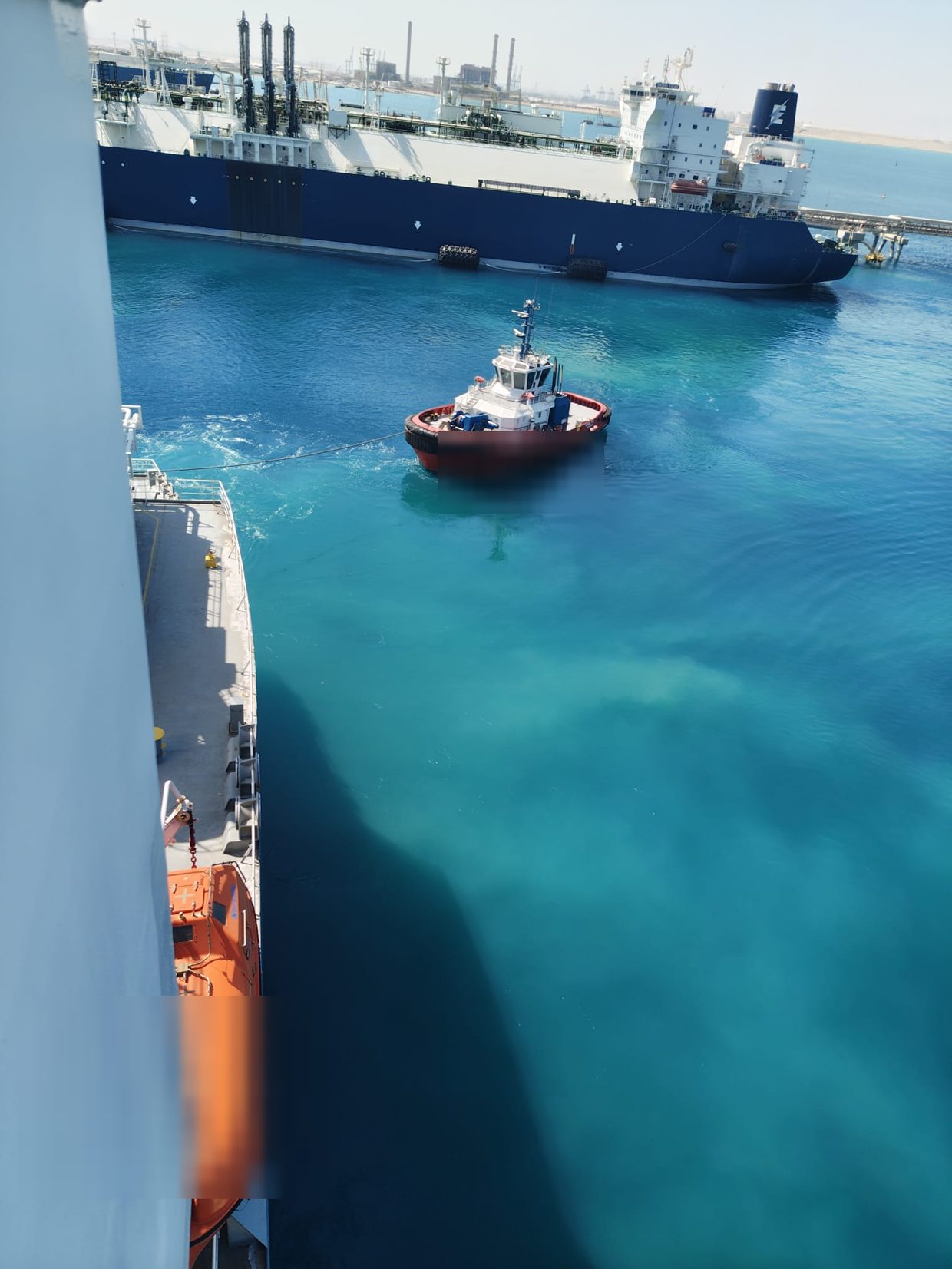 Harbour tug attending the LNG carrier and FSRU during the STS operation at Ain Sukhna