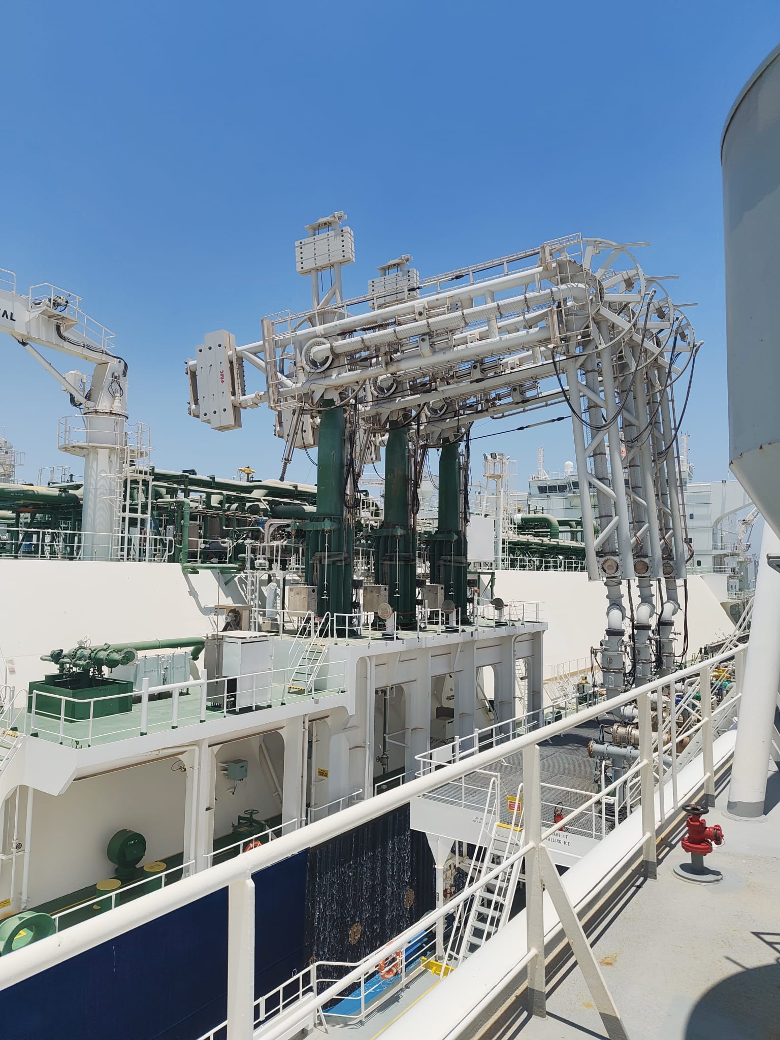 Transfer manifold and loading arms rigged on deck during the STS operation at Ain Sukhna