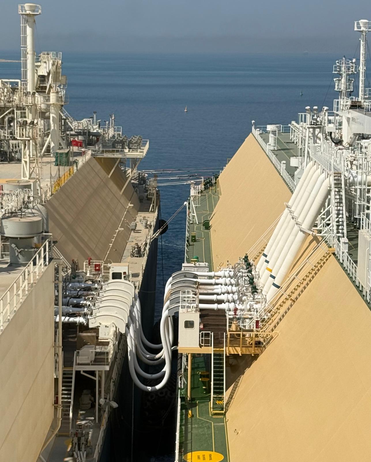 Cryogenic transfer hoses rigged between the FSRU and the LNG carrier moored close alongside at Ain Sukhna