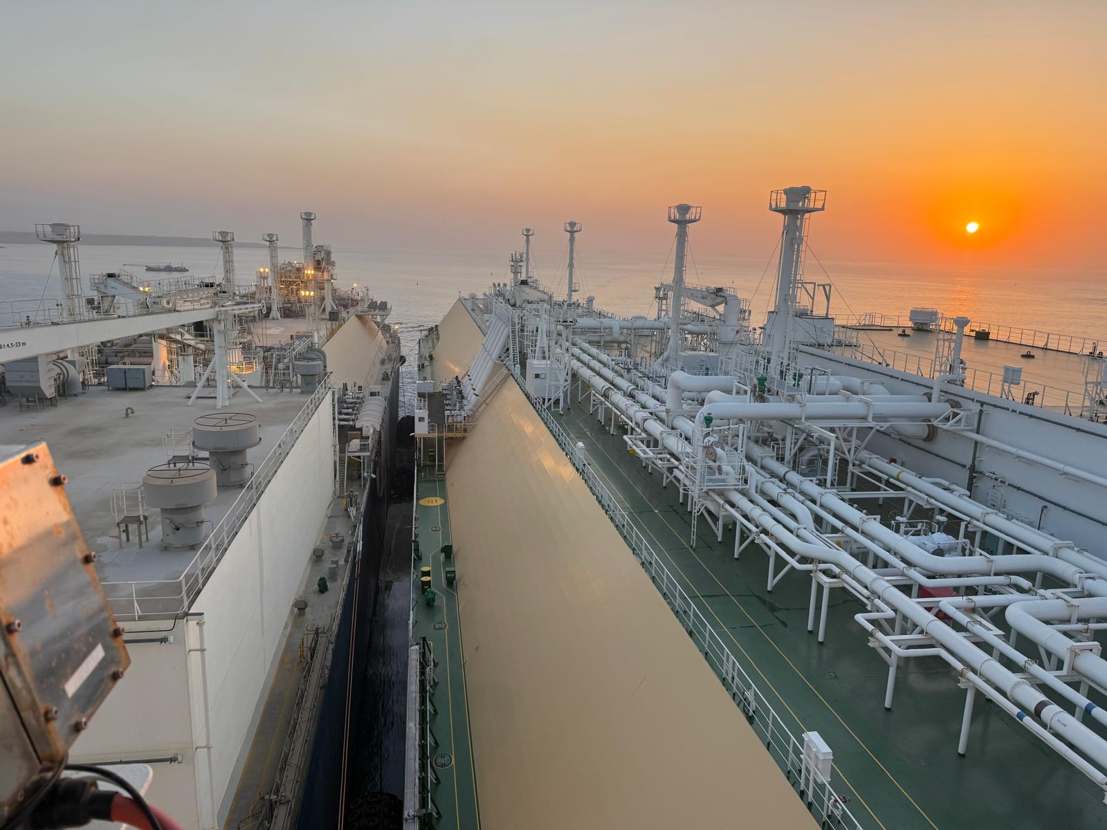 The FSRU and the LNG carrier alongside at sunrise on the Gulf of Suez during the ship-to-ship transfer