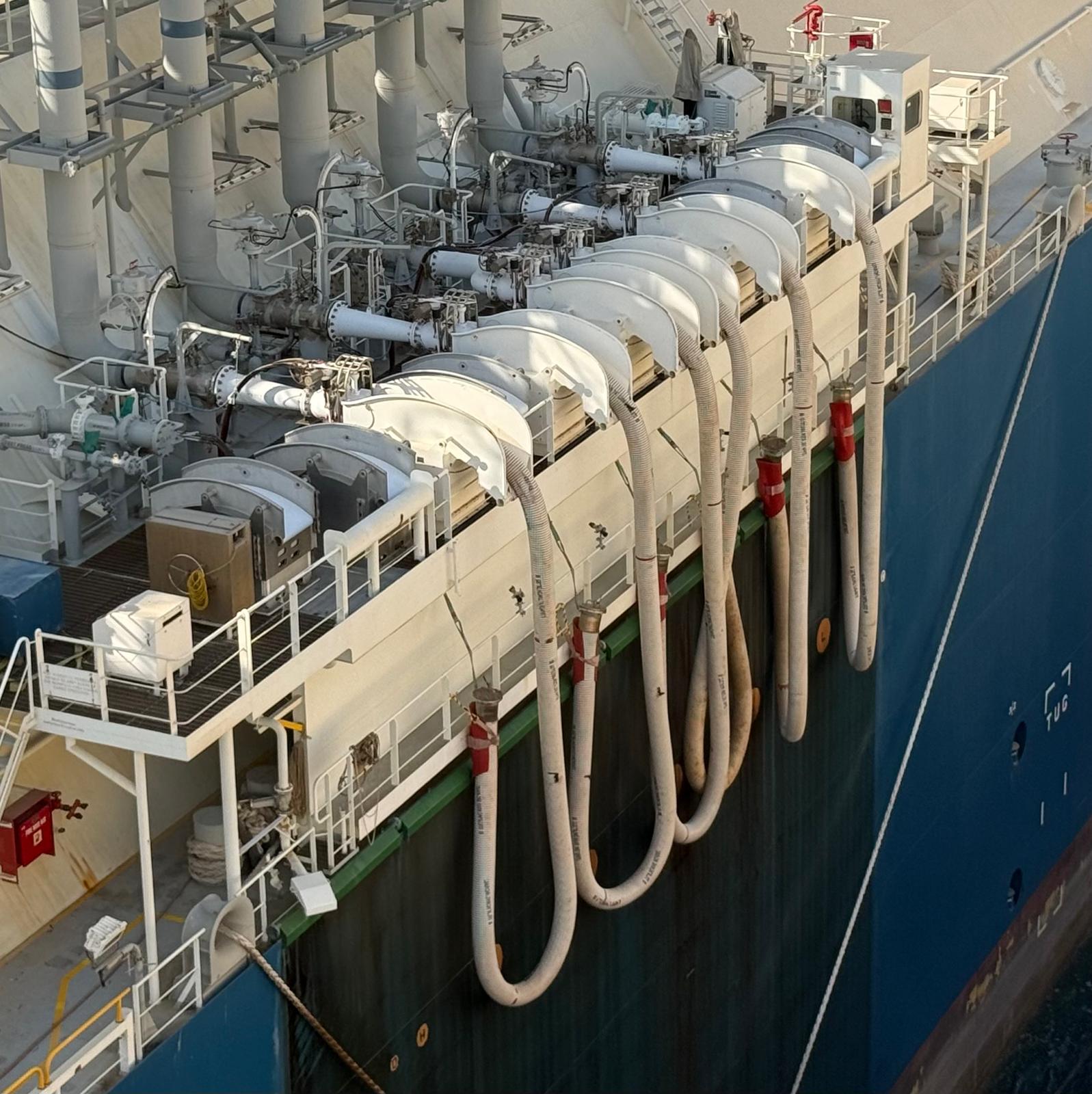 Transfer manifold and cryogenic hoses connected over the ship's side during the STS operation at Ain Sukhna