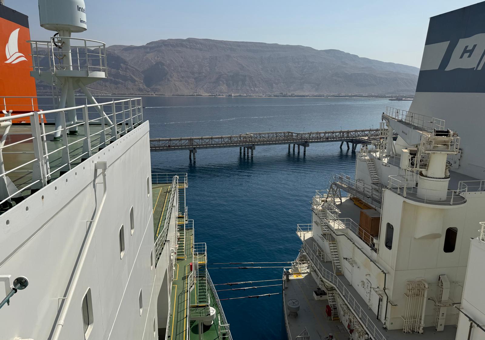View between the two vessels moored alongside towards the SUMED terminal jetty and the Egyptian mountains