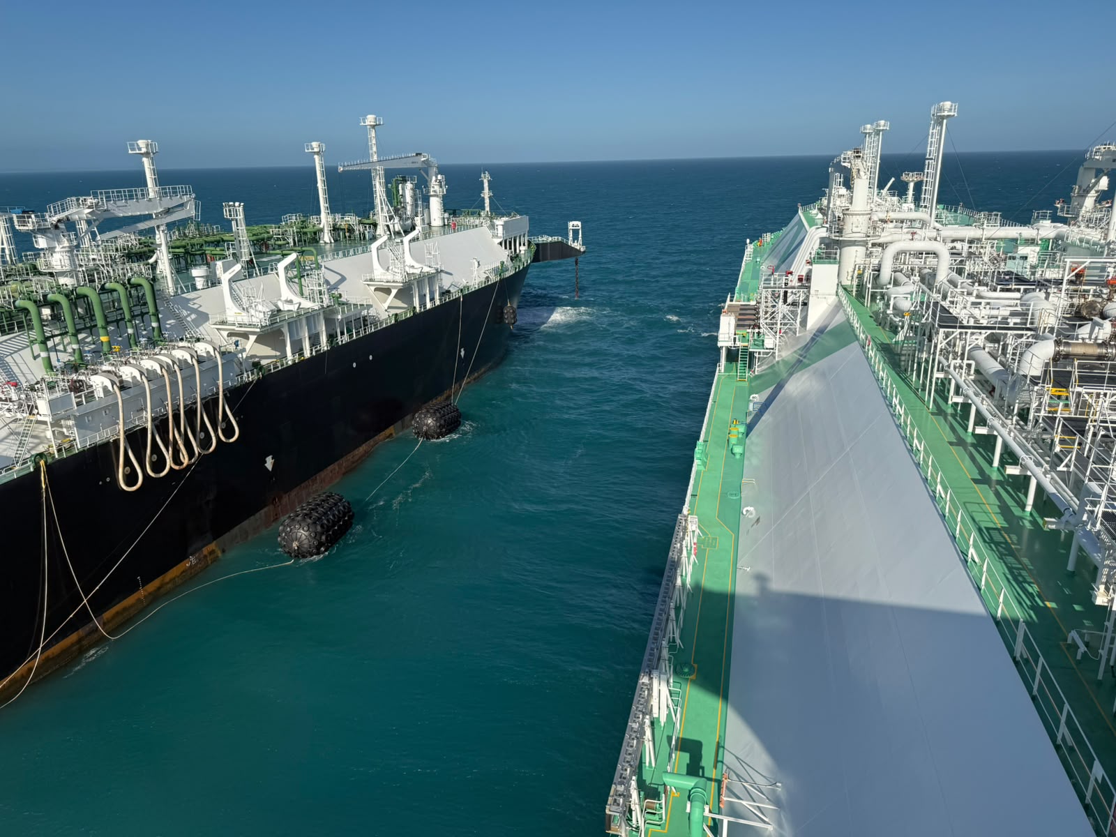 LNG carrier and FSRU Energos Nanook moored side by side with pneumatic fenders offshore Sergipe, Brasil