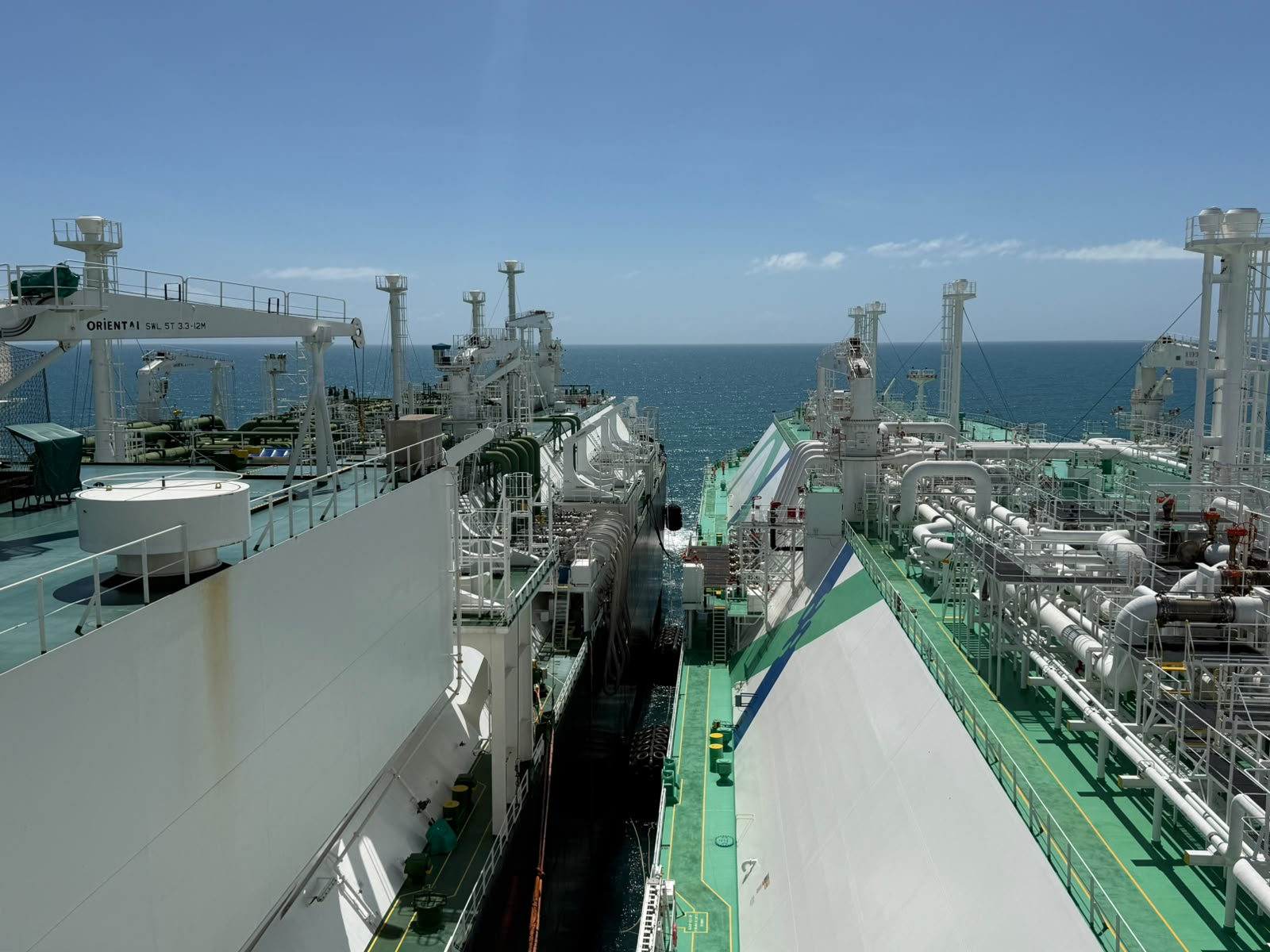 Decks of the LNG carrier and FSRU alongside during the ship-to-ship transfer off Sergipe